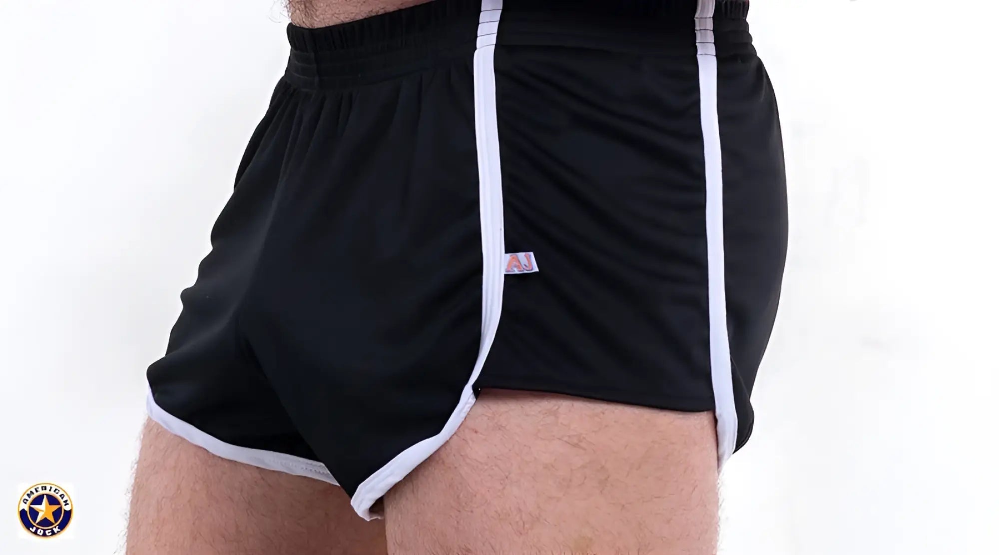 A J Basics 8 inch black athletic shorts with white side stripes elastic waistband and hem trim for active wear