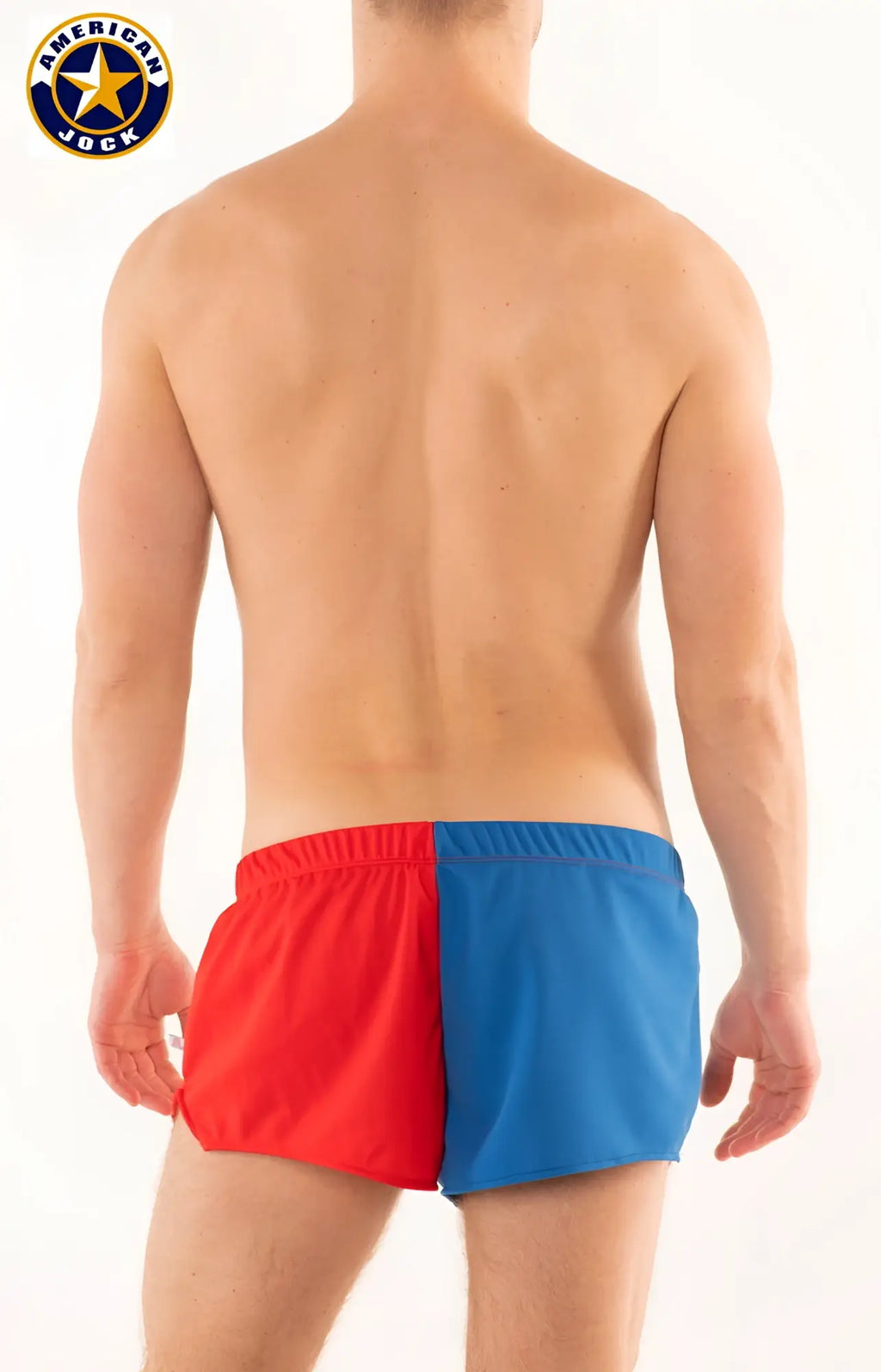 A j competitor running short men’s swim trunks in bold red and blue color-block design for active use