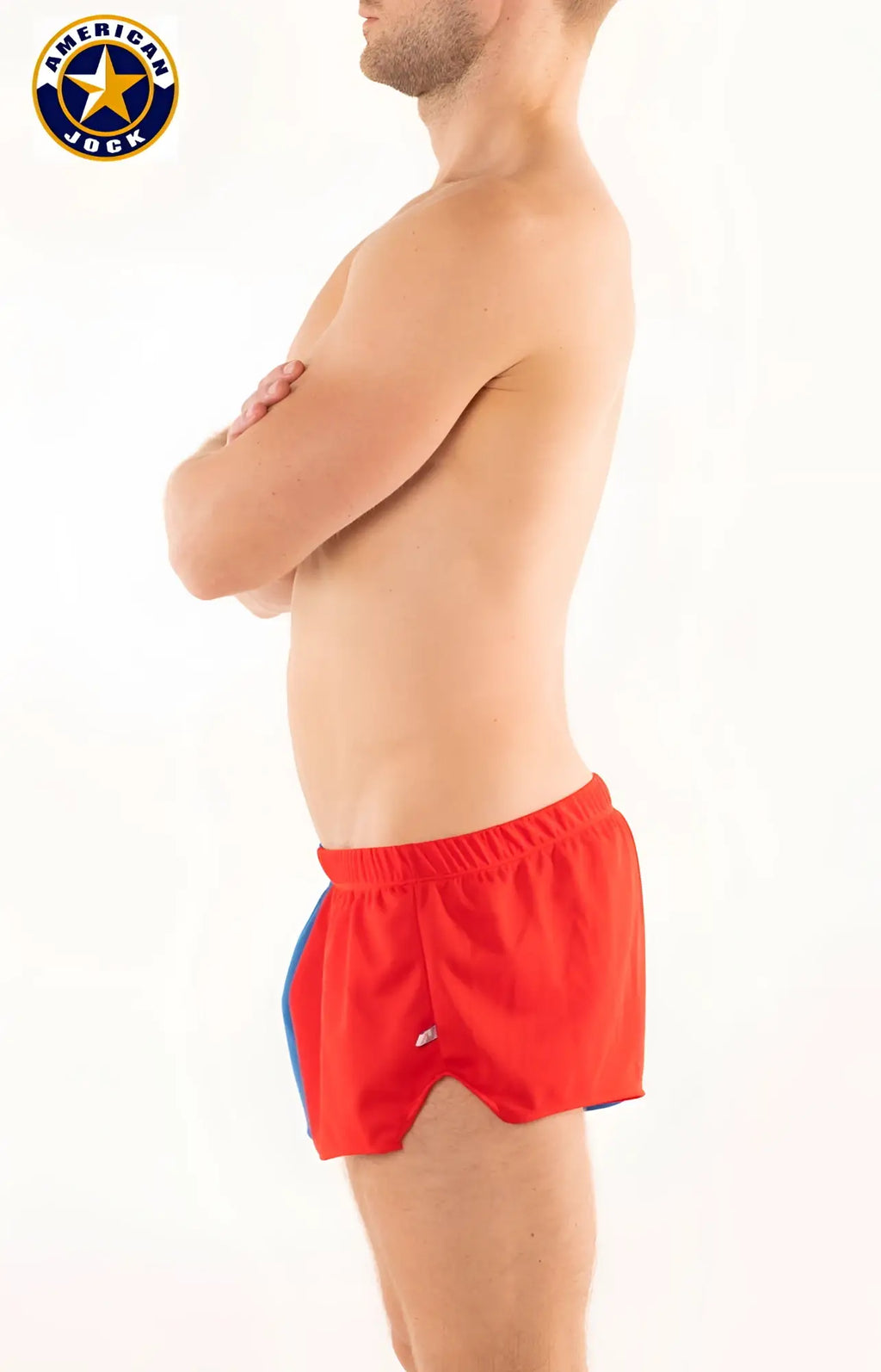 A j competitor running short in red with blue side panels and elastic waistband designed for athletic use
