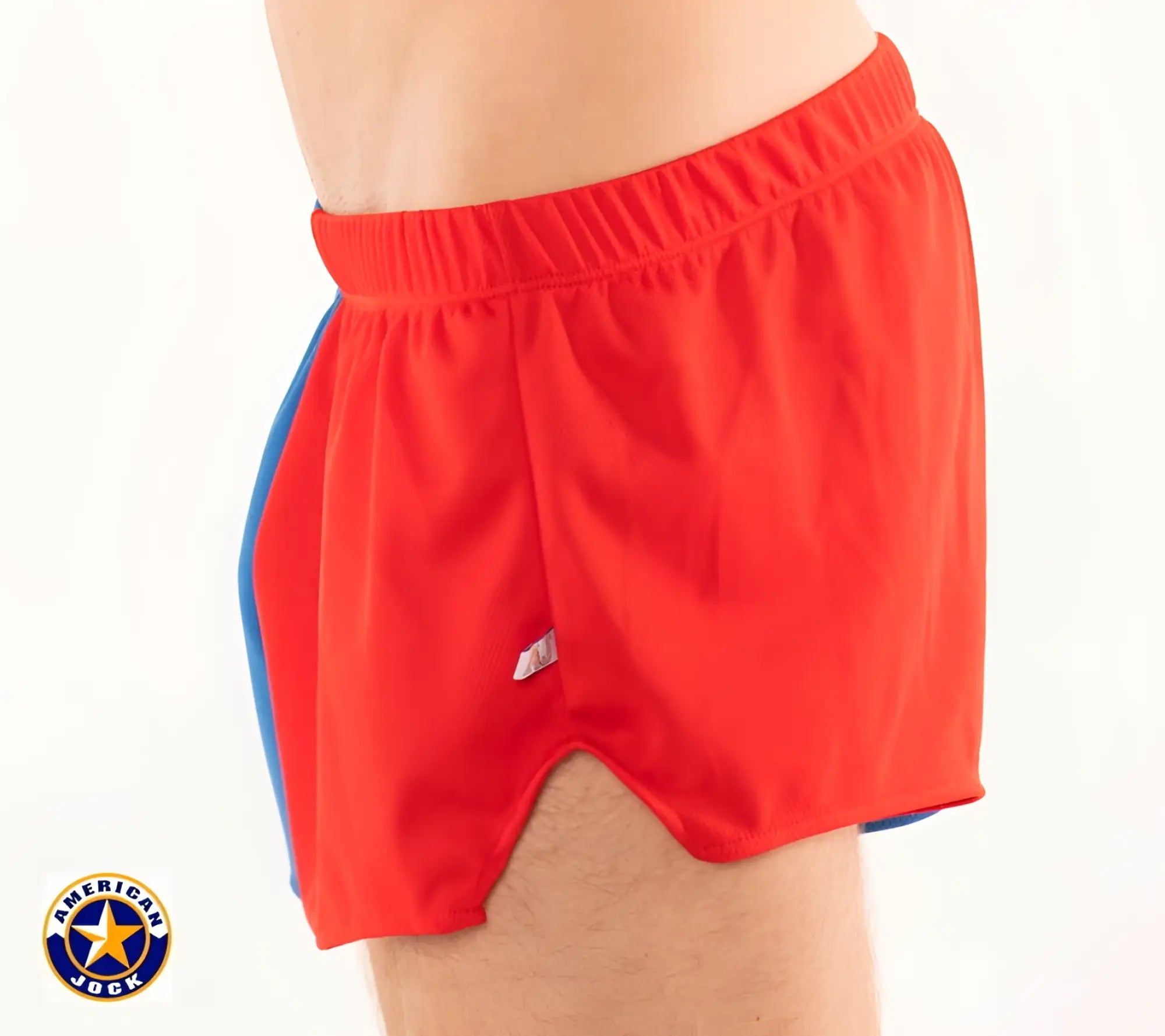 A j competitor running short featuring red athletic shorts with blue side panels and an elastic waistband