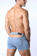 Light-wash denim j-flo peek-a-boo booty short with frayed hem and distinctive back cutout shown from the back view