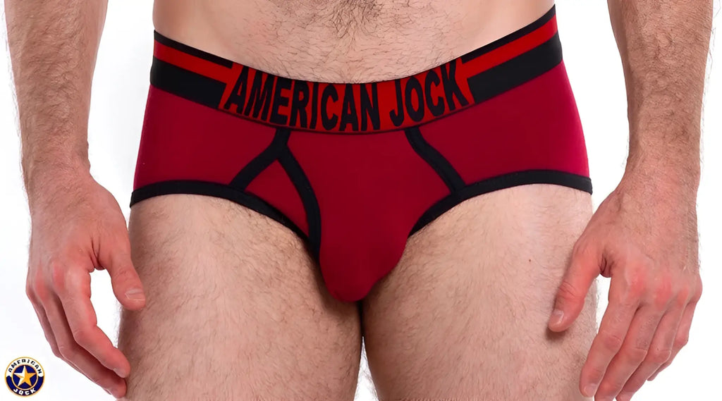 Red american jock briefs with black trim and bold lettering on the waistband from a j gym brief collection