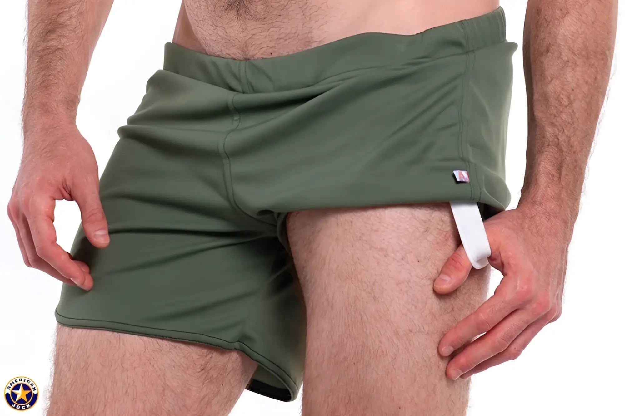 Olive green a j gym shorts with built-in jockstrap featuring a white elastic side strap for athletic use