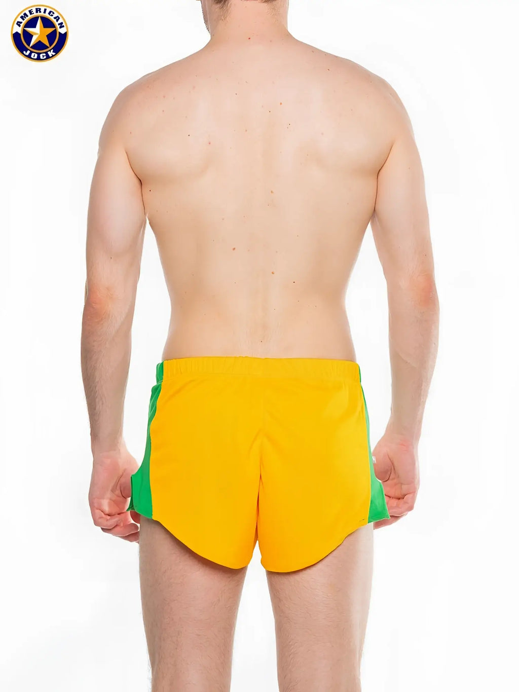 Bright yellow a j javelin field short with green side panels and a classic american jock logo on the left thigh