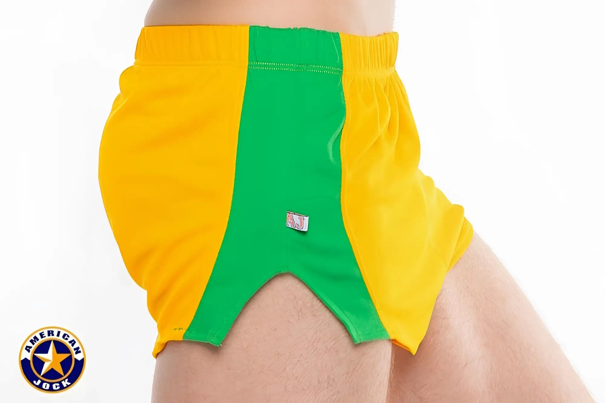 A j javelin field short featuring vibrant yellow and green american jock shorts with bold color-block design