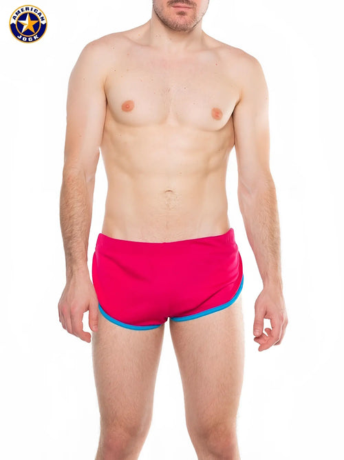 A j javelin side split short bright pink swim trunks with contrasting blue trim designed for swimming and beachwear