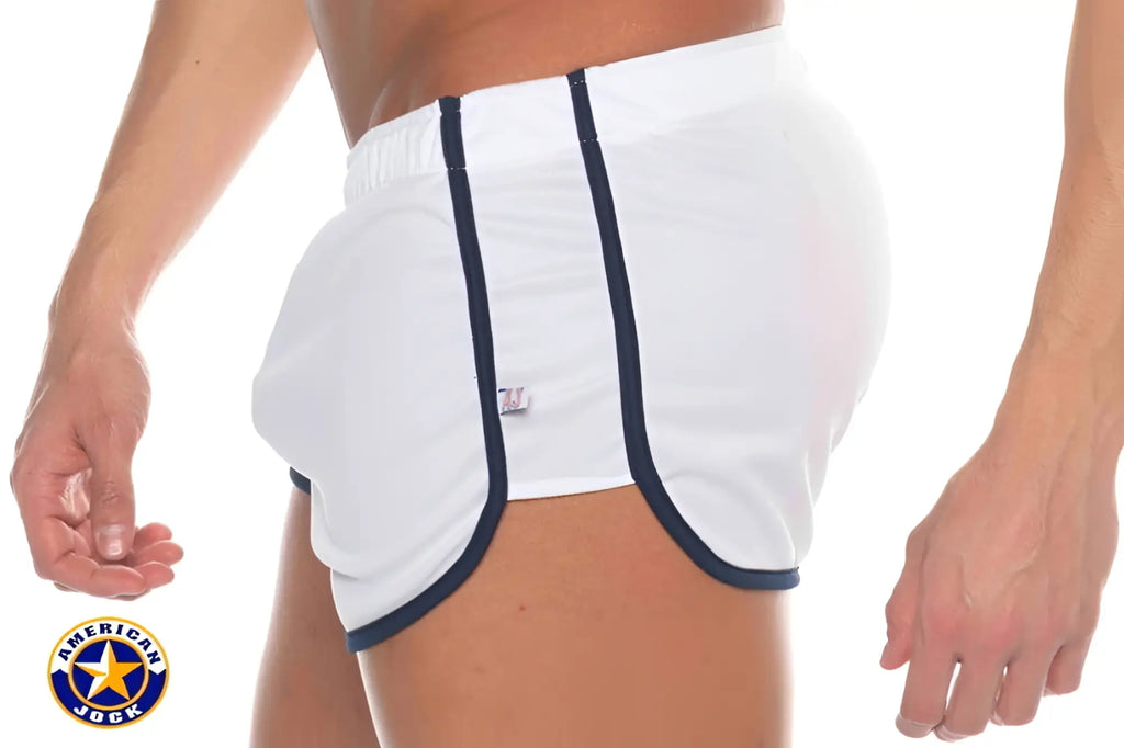A j phys ed track short made of white american jock shorts with navy blue trim and an elastic waistband