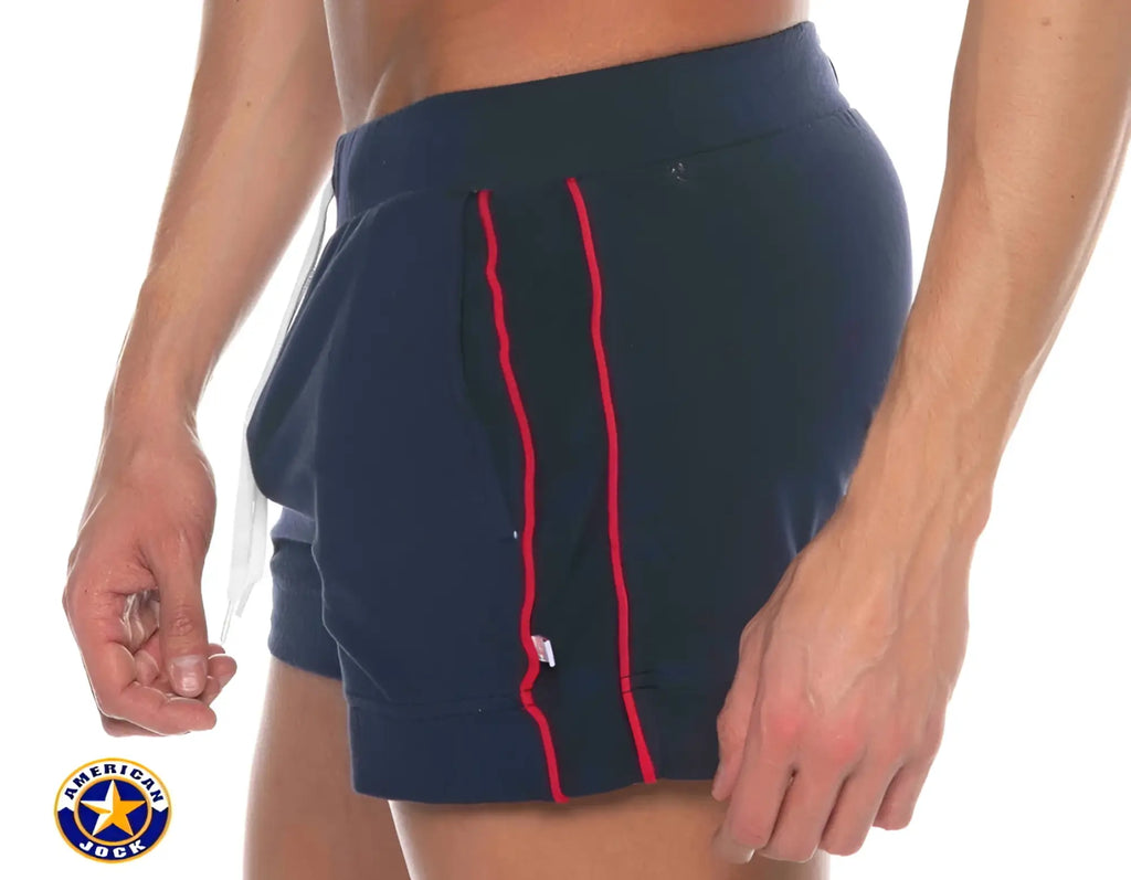 Navy blue american jock shorts with red side stripes and pockets designed for physical education and volleyball use