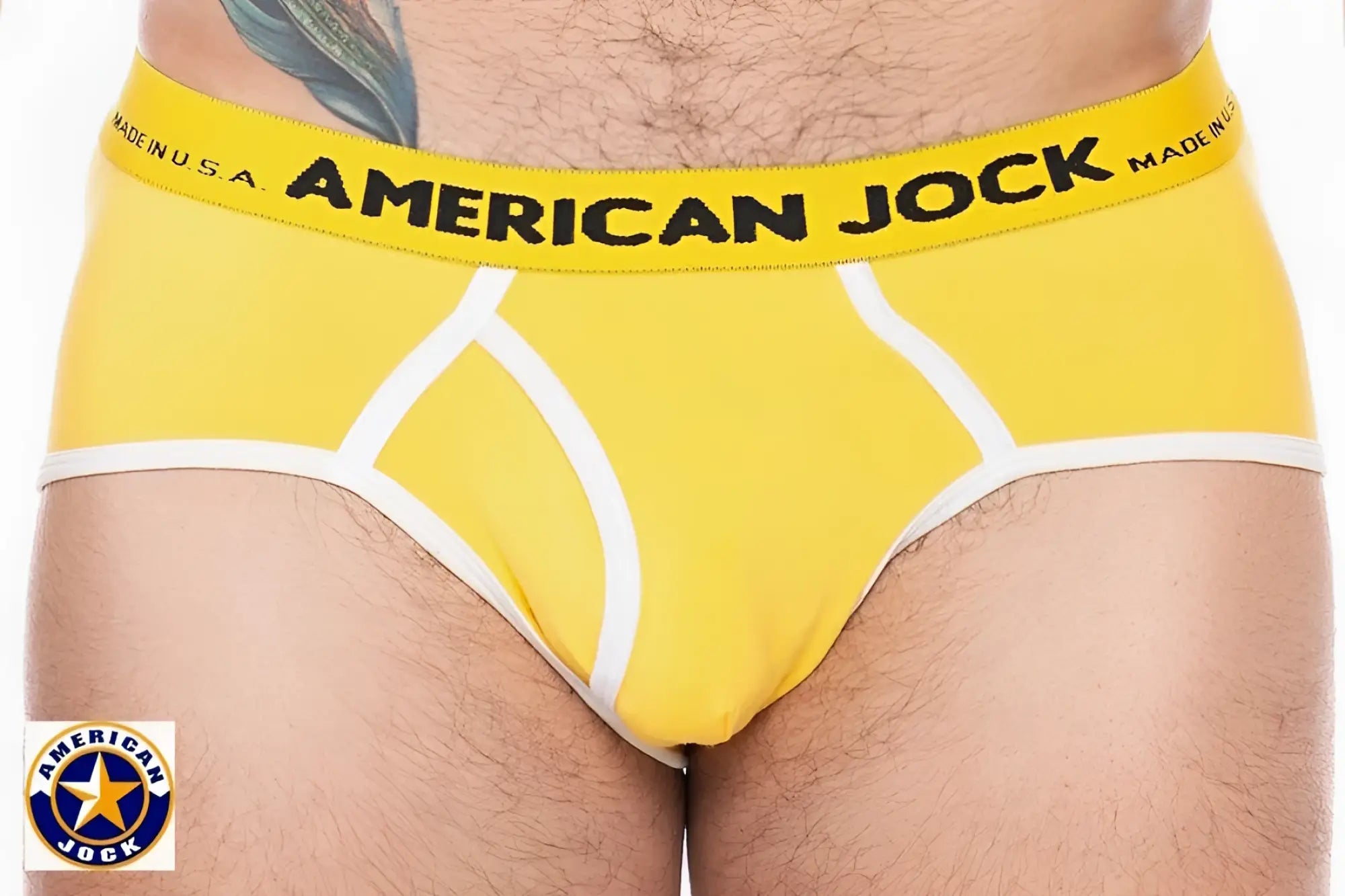 Bright yellow A J sport brief jock briefs with white trim and bold black waistband branding