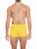 Bright yellow A J Sports short swim trunks with single button closure and front flap pocket for beachwear