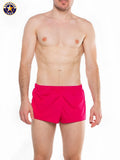 A J Ultra running short in bright pink with a solid design and elastic waistband for athletic use