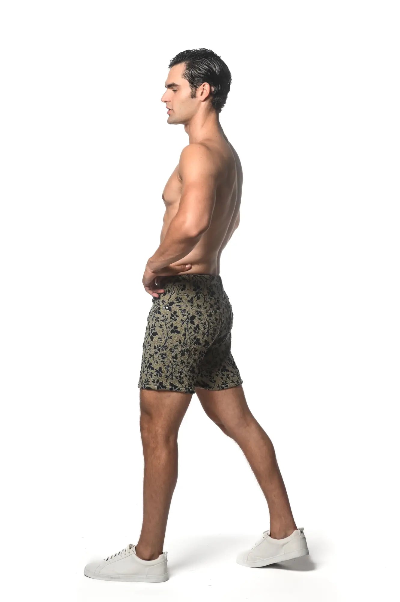 Men’s olive green jacquard printed stretch knit shorts with subtle black floral pattern for casual wear