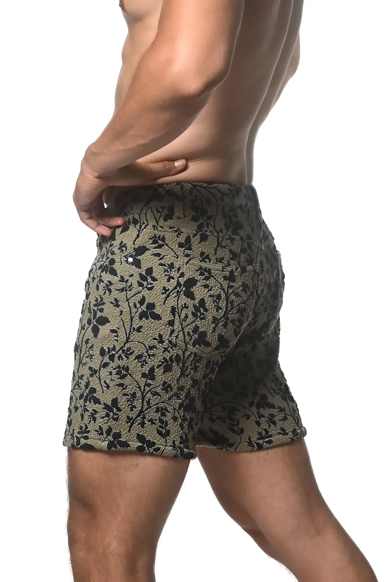 Olive green jacquard printed stretch knit shorts with black floral pattern and textured fabric for comfortable wear