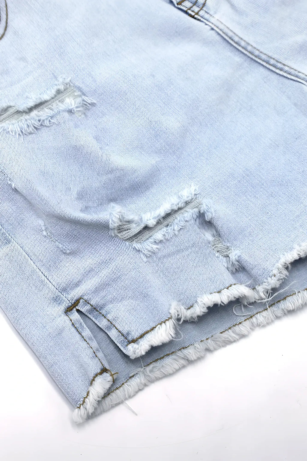 Light sky blue jaded 3.5 inch denim short shorts with frayed distressed edges and raw hem in light-wash denim