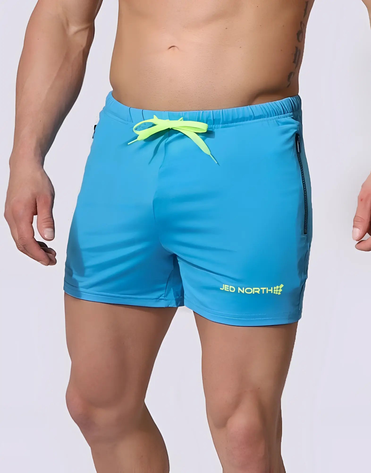 Bright blue jed north agile bodybuilding 4 inch shorts with neon yellow drawstring and zipper side pocket in aqua blue
