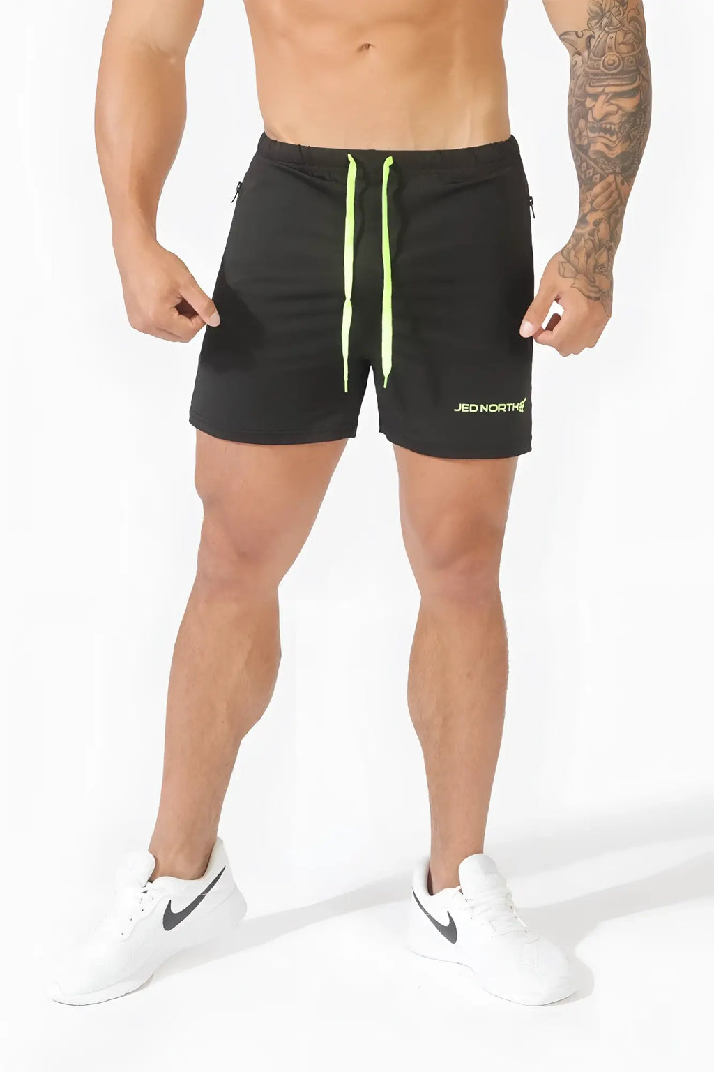 Black jed north agile bodybuilding 4 inch shorts with neon green drawstrings and zipper pockets for workouts