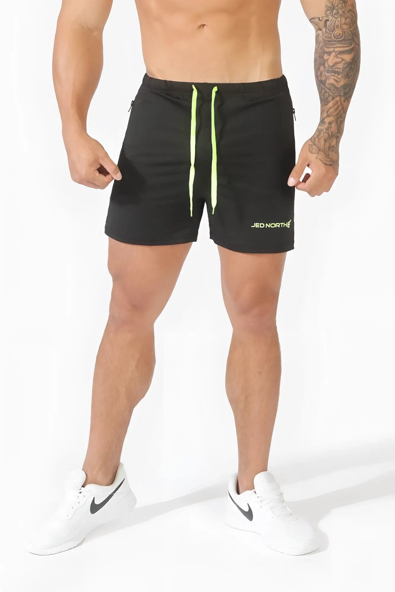 Black jed north agile bodybuilding 4 inch shorts with neon green drawstrings and zipper pockets for workouts