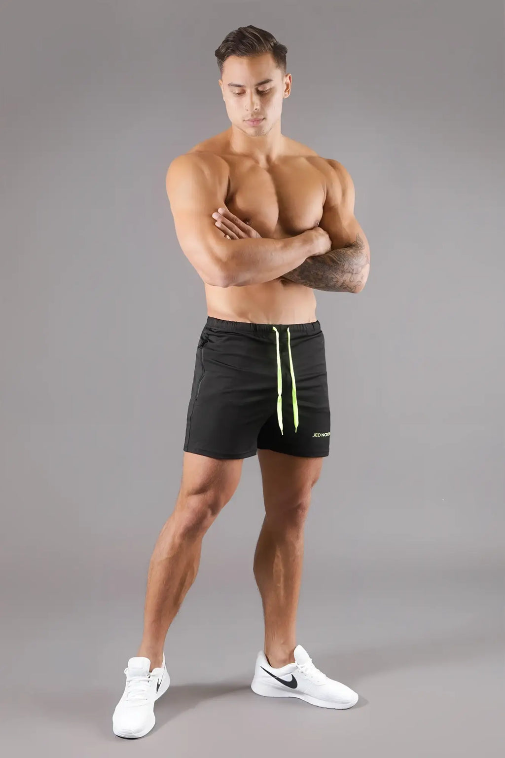 Jed north agile bodybuilding 4 inch black athletic shorts with neon green drawstrings and zipper pockets