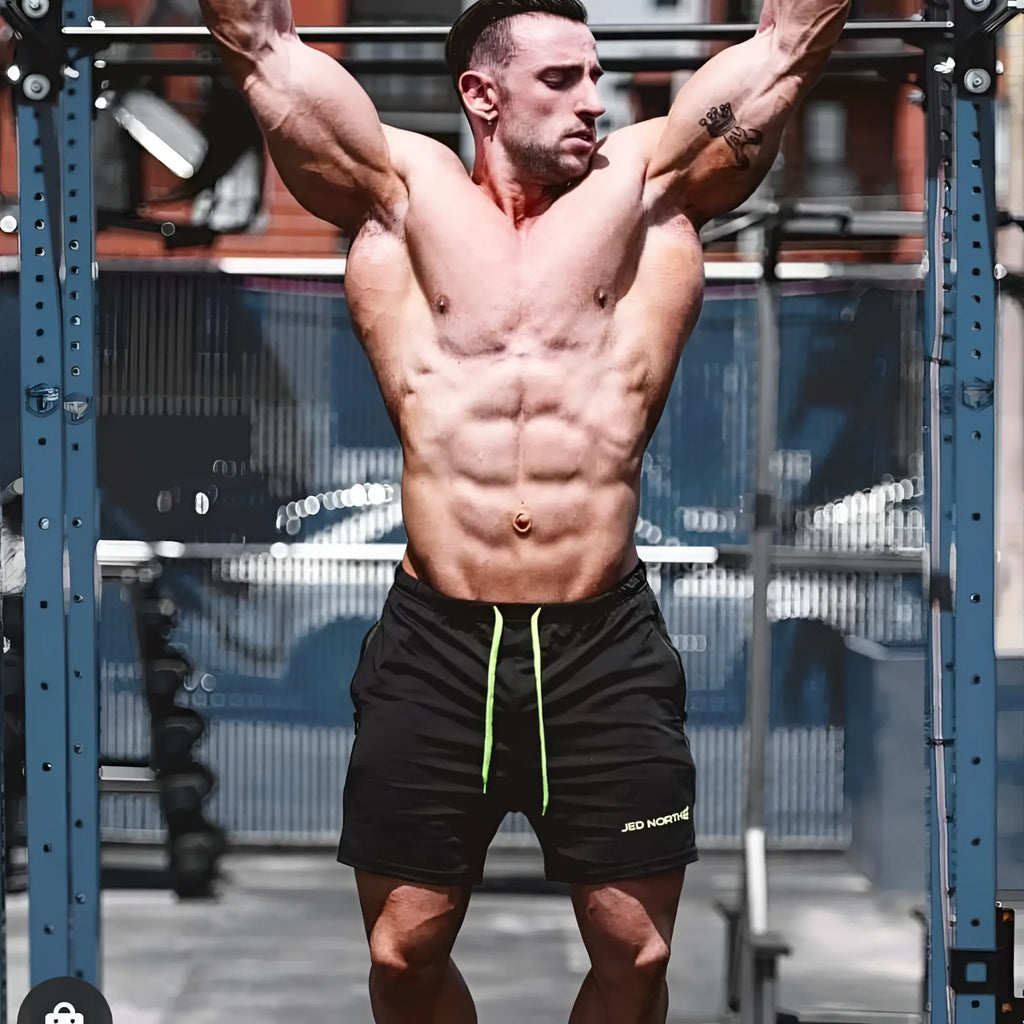 Black Jed North agile bodybuilding shorts with neon green drawstrings zipper pockets and logo on lower right leg