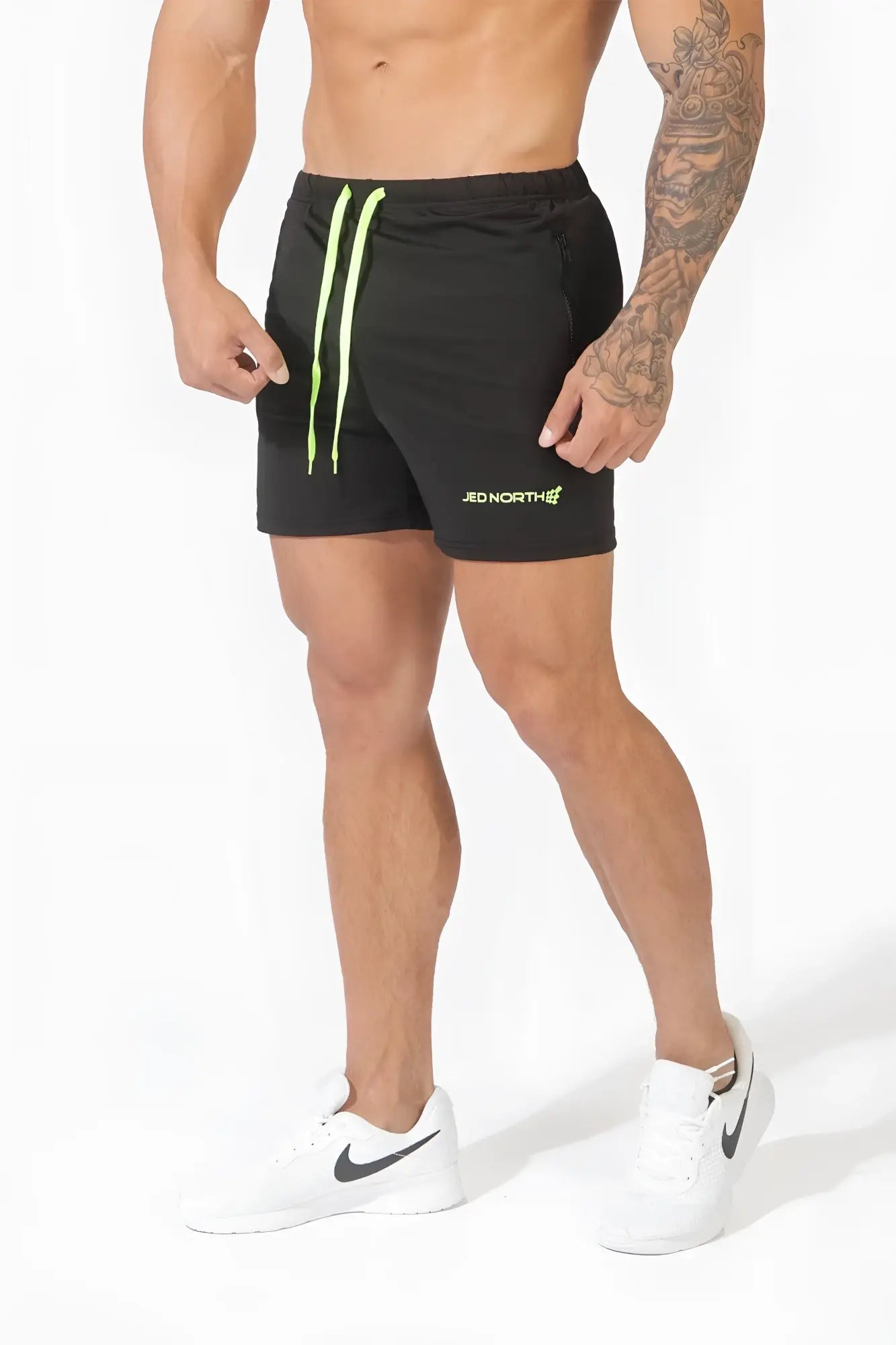 Black jed north agile bodybuilding 4 inch shorts with neon green drawstrings and zipper pockets for workout use