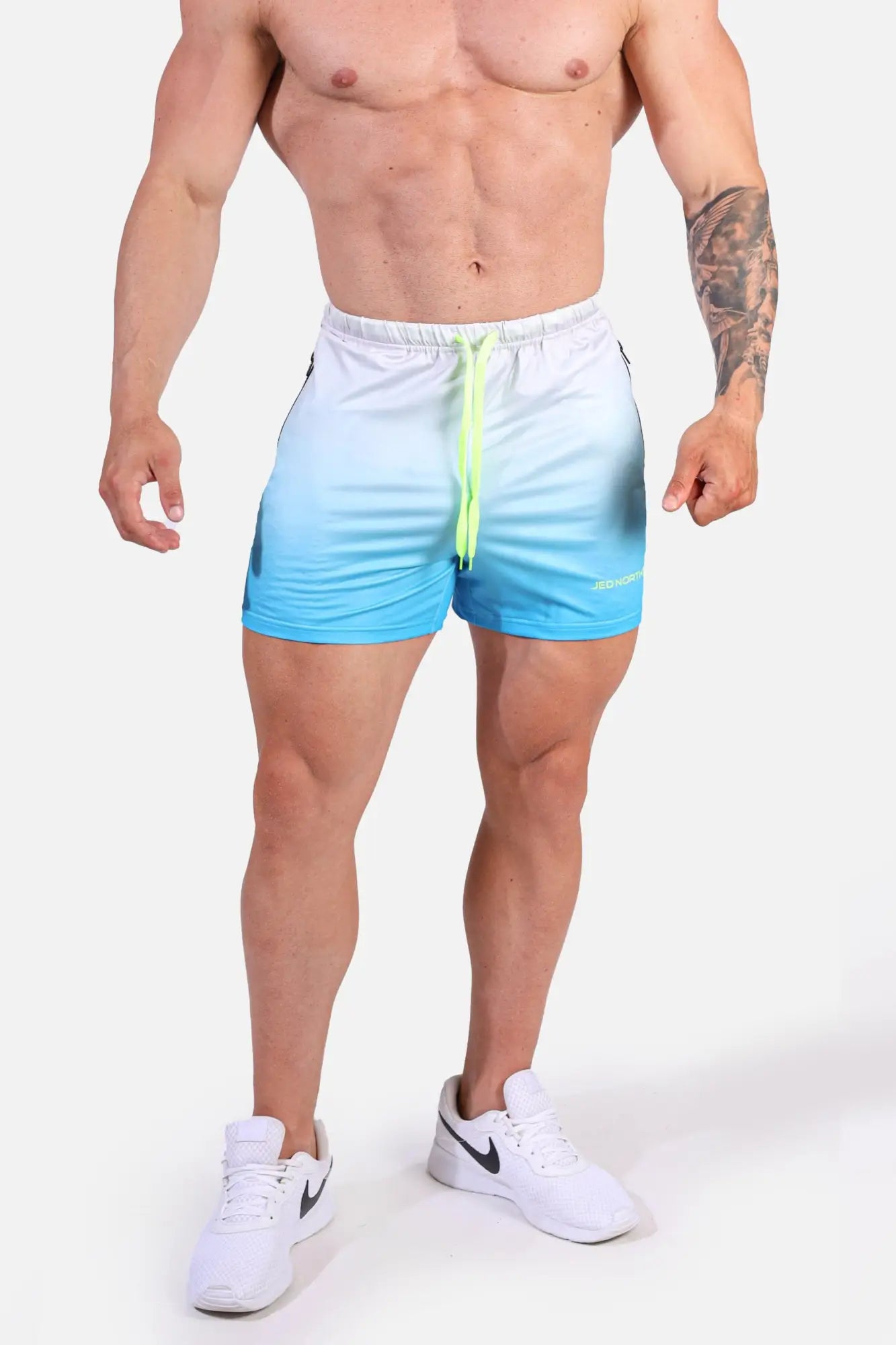 Jed north agile bodybuilding 4 inch shorts in blue ombre with zipper pockets and neon green drawstring for gym use