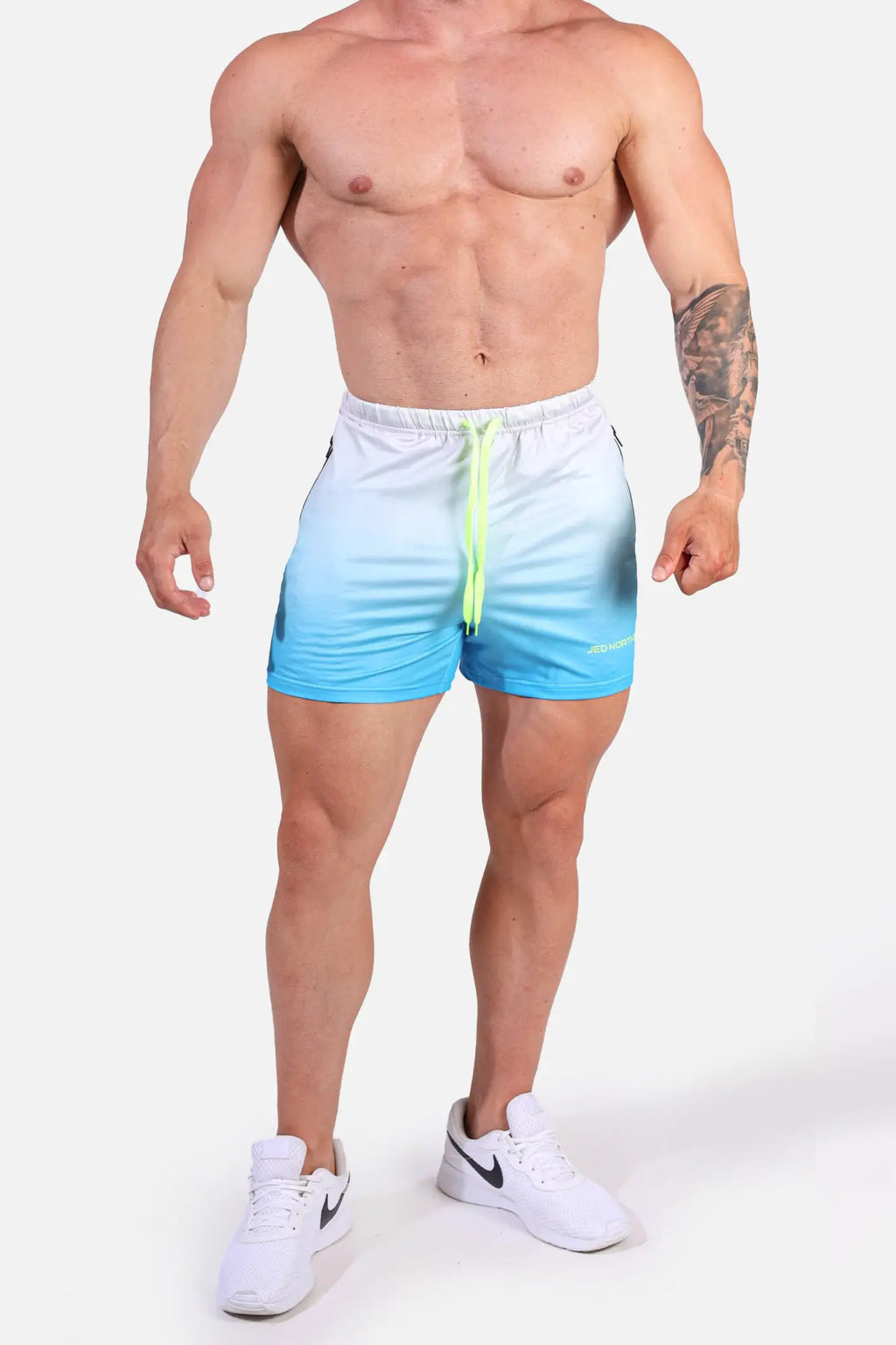 Blue and white gradient Jed North Agile bodybuilding shorts with neon green drawstring and zipper pockets