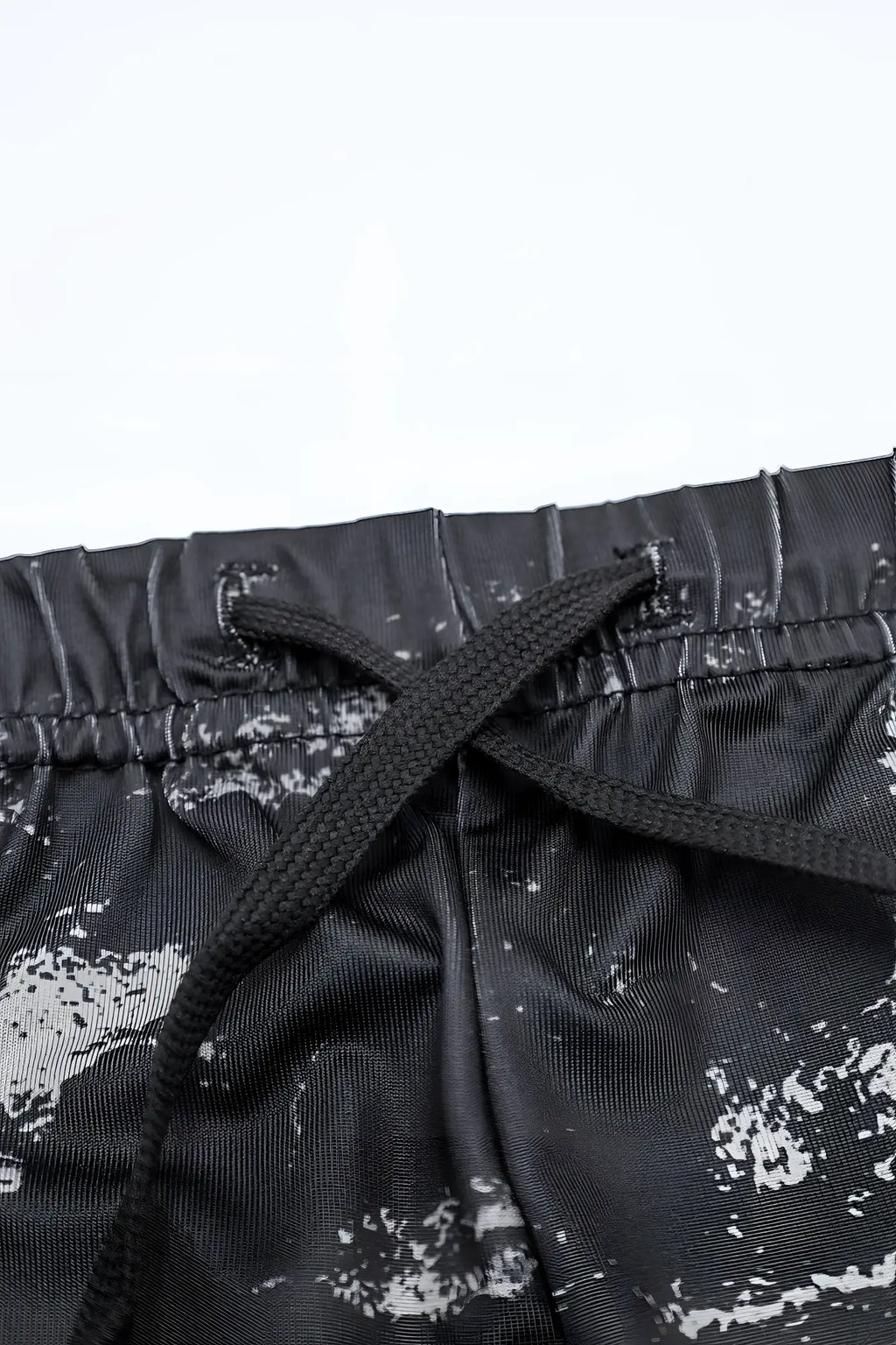 Agile Bodybuilding 4 inch brushed black athletic shorts with white splatter print and matching drawstring waistband