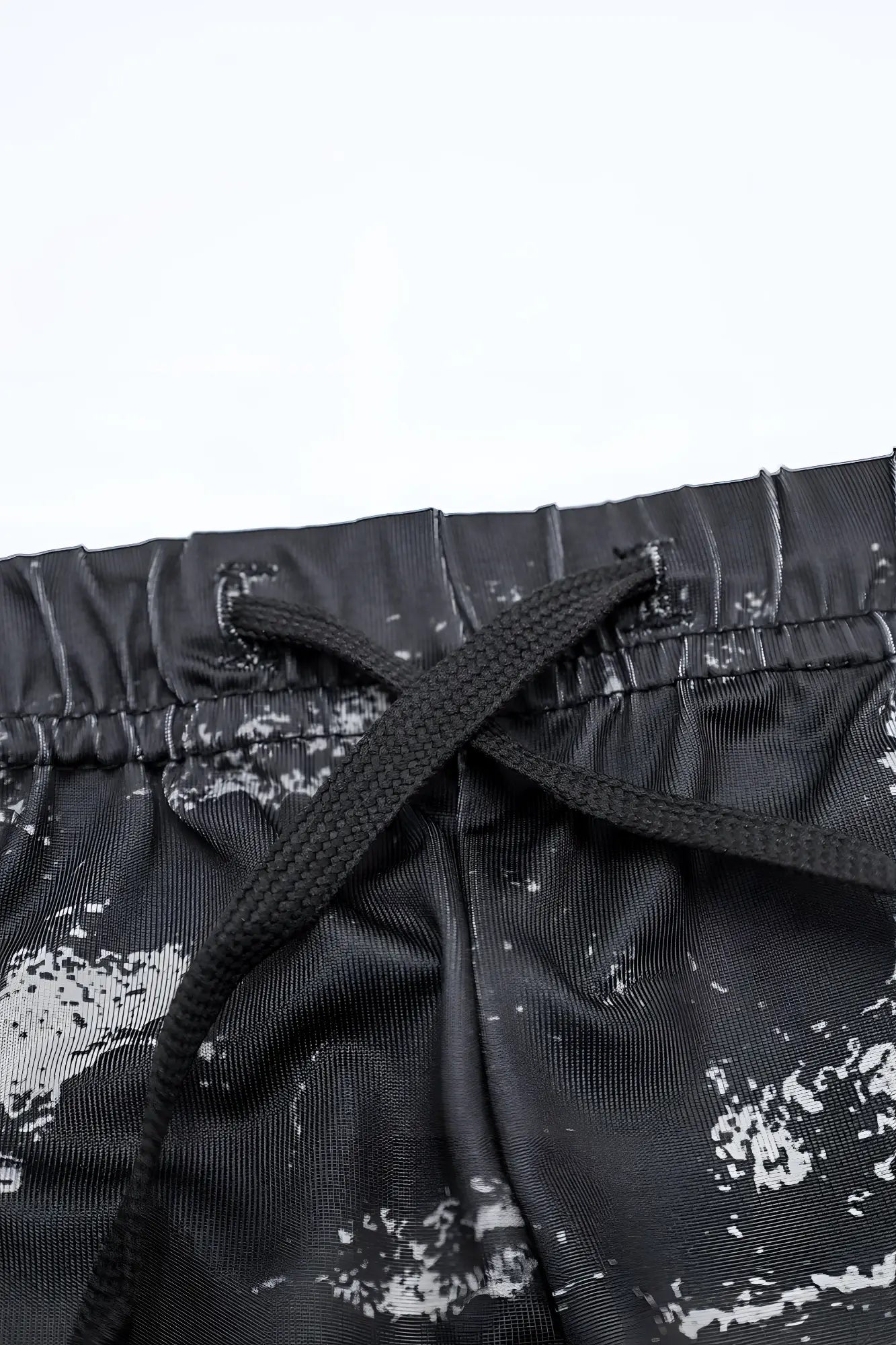 Agile Bodybuilding 4 inch brushed black athletic shorts with white splatter print and matching drawstring waistband