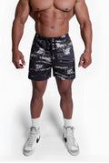 Agile bodybuilding 4 inch shorts with zipper pockets in black and white distressed pattern with elastic waistband