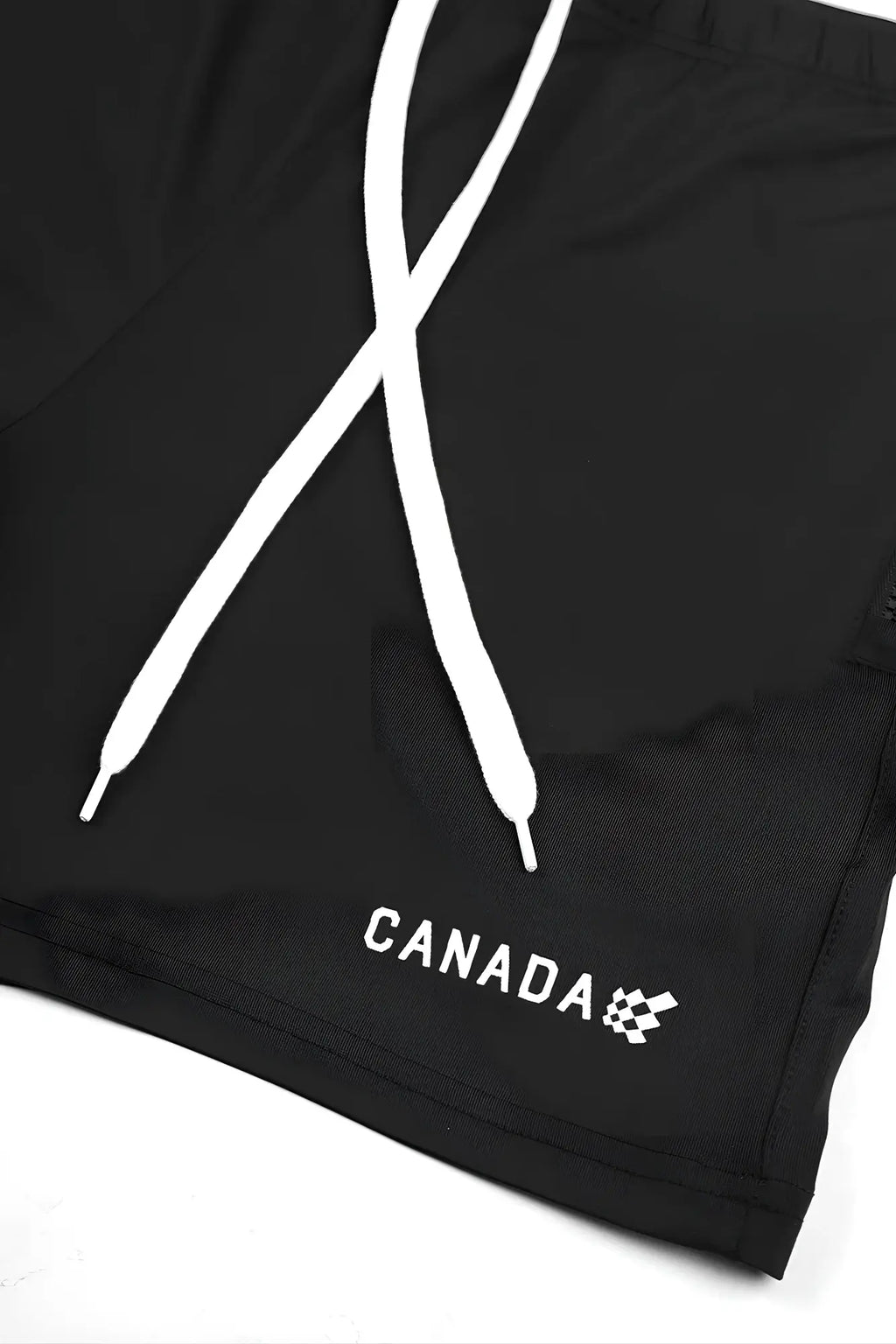 Black agile bodybuilding 4 inch swim shorts with white drawstrings zipper pockets and canada logo embroidery near hem