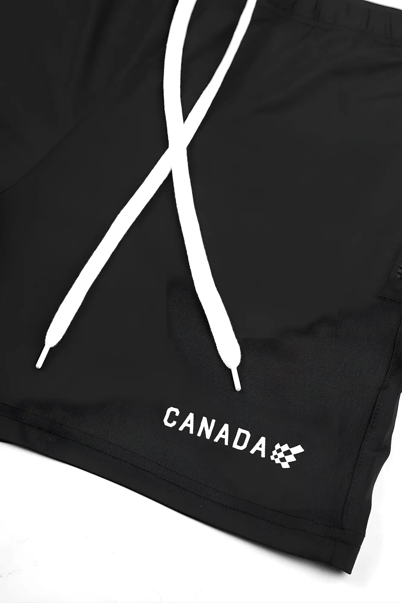 Black agile bodybuilding 4 inch swim shorts with white drawstrings zipper pockets and canada logo embroidery near hem