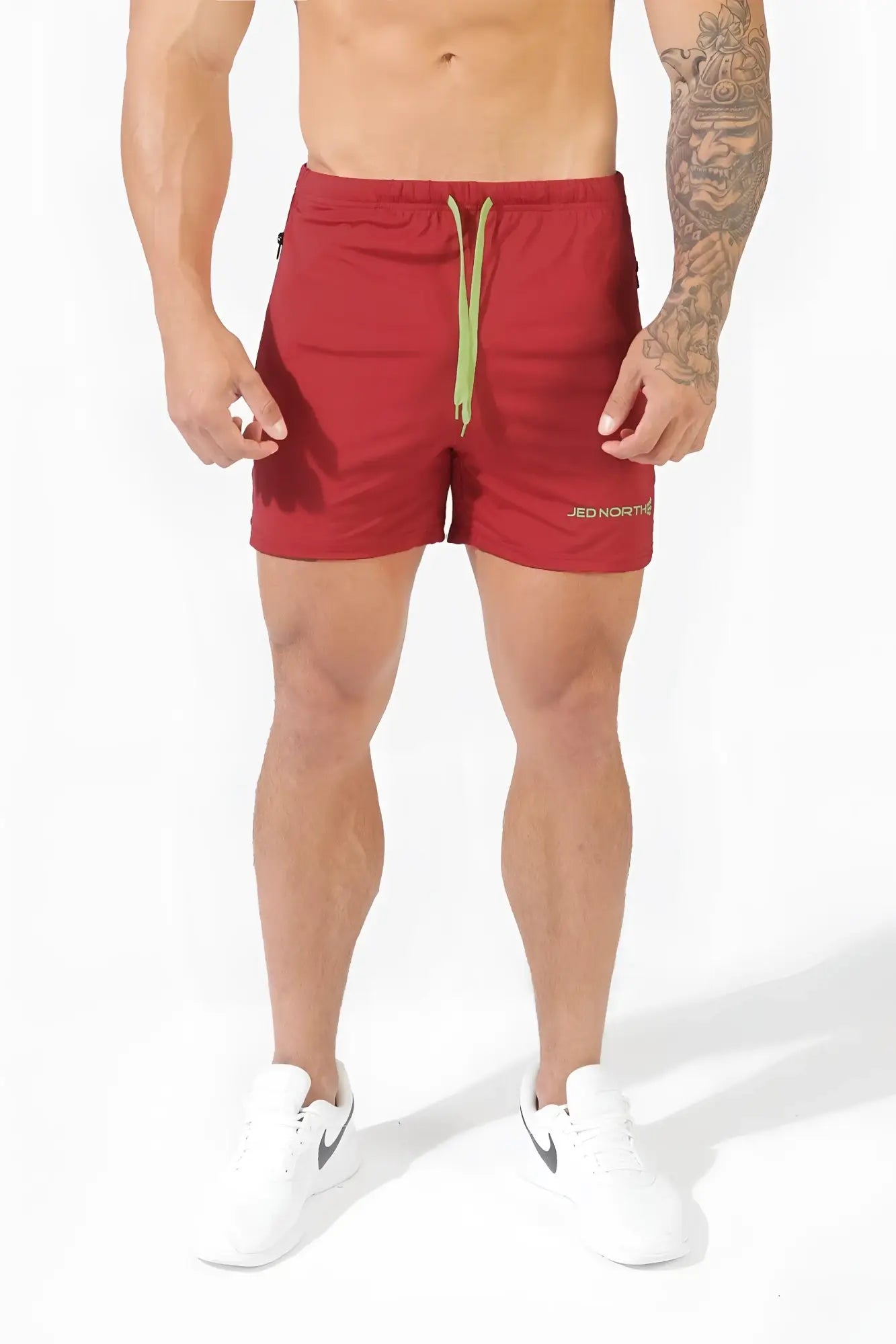 Jed North agile bodybuilding 4 inch crimson red athletic shorts with light green drawstring and zipper pockets