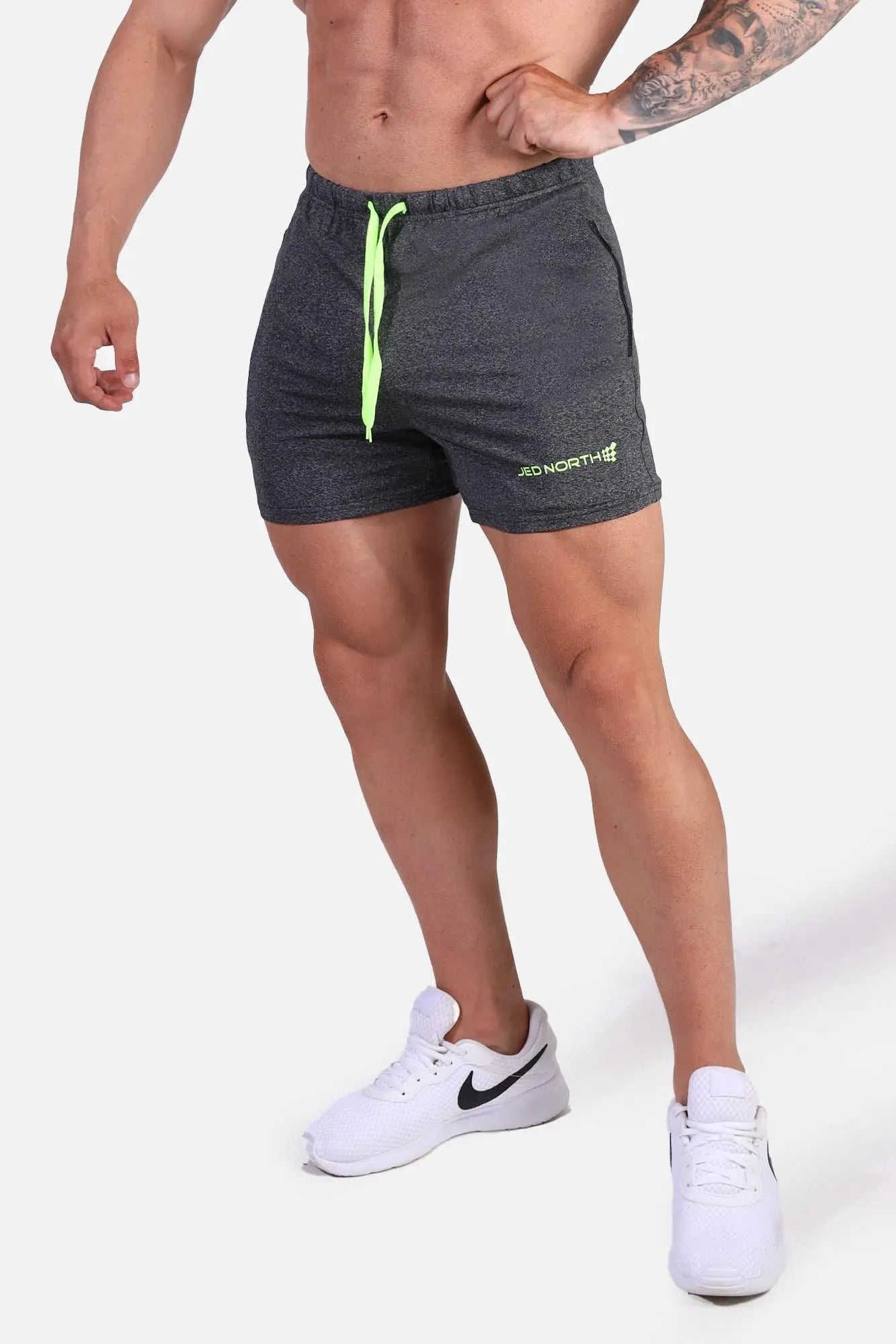 Dark gray heather jed north agile bodybuilding 4 inch shorts with neon green drawstring and zipper pockets