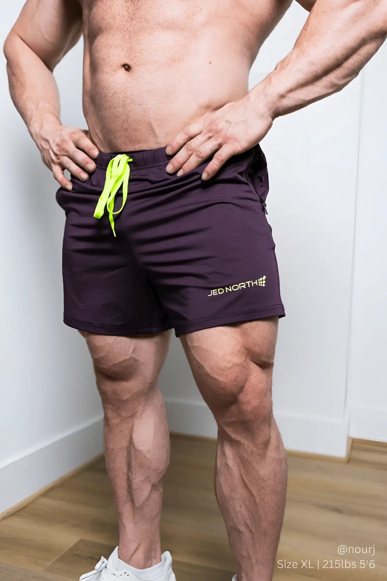 Jed north agile bodybuilding 4 inch dark purple athletic shorts with neon green drawstrings and embroidered logo