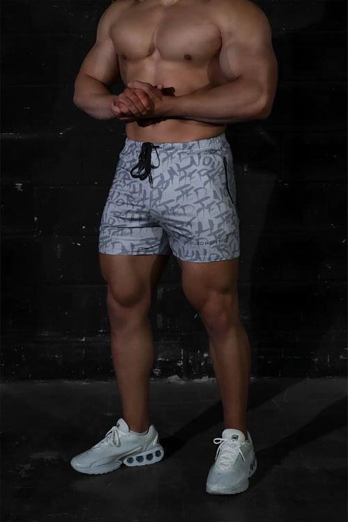 Gray jed north agile bodybuilding shorts with black abstract logo pattern elastic waistband and zipper side pockets