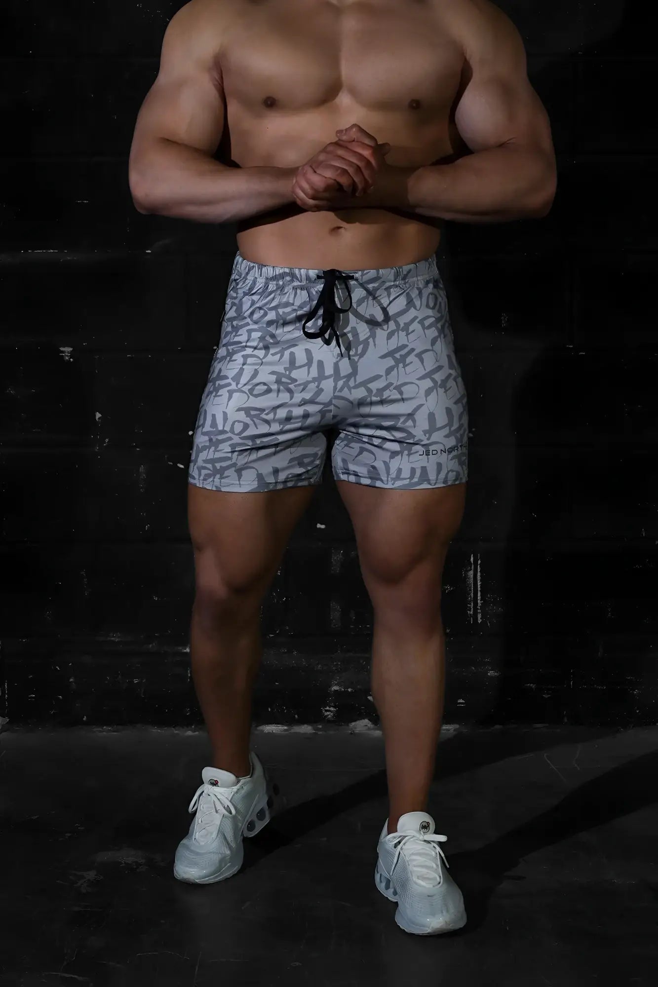 Gray graffiti jed north agile bodybuilding 4 inch shorts with black and white abstract pattern and elastic drawstring waistband