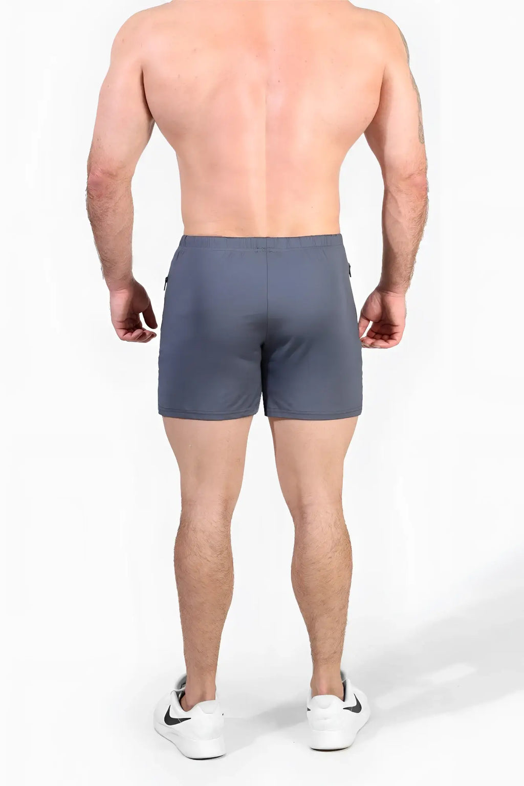 Gray agile bodybuilding 4 inch shorts with zipper pockets featuring a sleek modern design and subtle side pockets