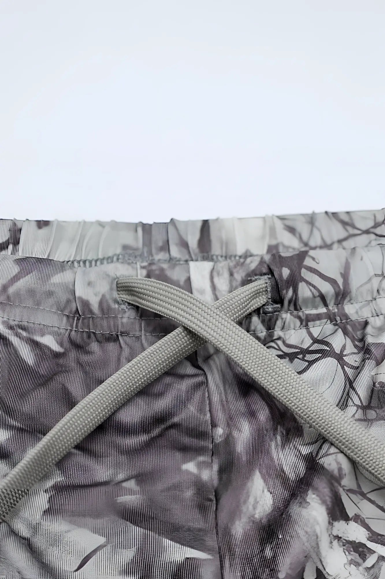Agile bodybuilding 4 inch shorts with gray tie dye pattern and matching drawstring waistband in leaf camo design