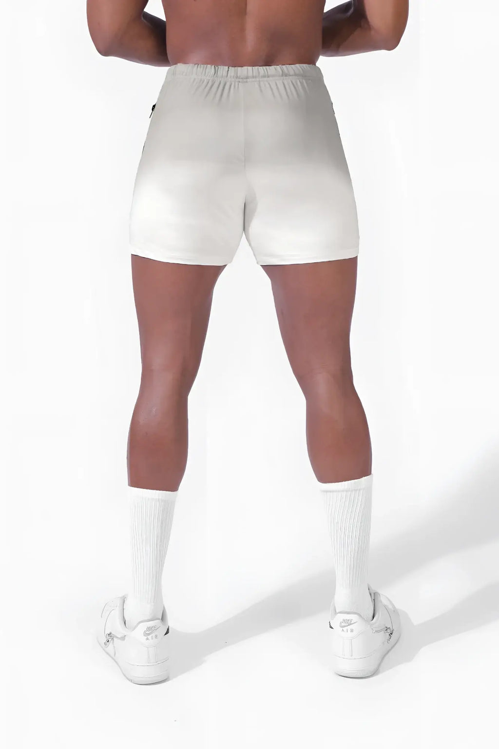 White agile bodybuilding 4 inch athletic shorts with elastic waistband and subtle ombré gray gradient finish