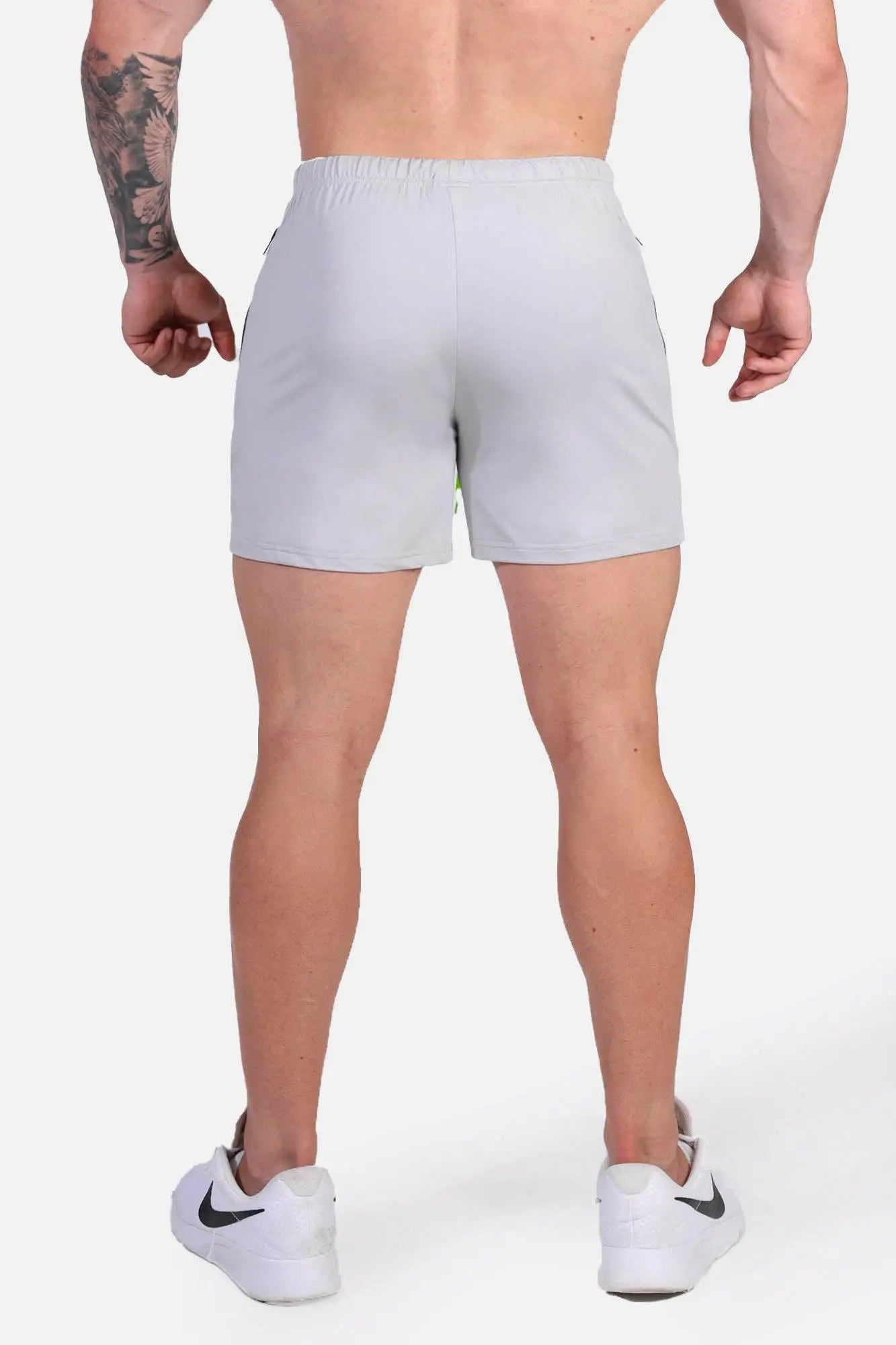 Light gray jed north agile bodybuilding 4 inch shorts with zipper pockets and subtle side panel detailing