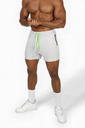 Jed north agile bodybuilding 4 inch platinum gray athletic shorts with neon green drawstrings and black zipper pocket
