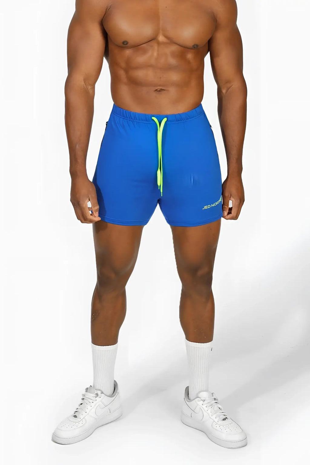 Bright blue jed north agile bodybuilding 4 inch athletic shorts with neon green drawstring and zipper pockets