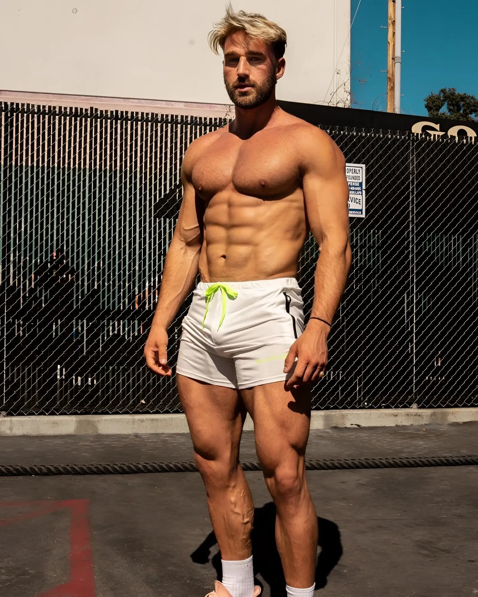 White athletic Jed North Agile bodybuilding 4 inch shorts with neon green drawstring and zipper pockets off white