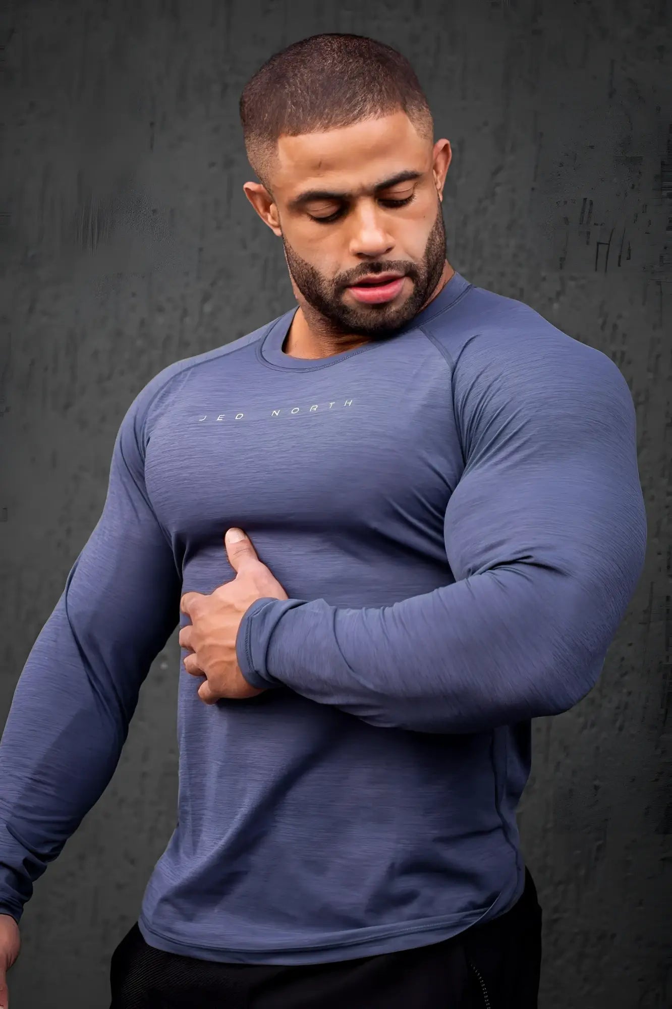 Jed North agile long sleeve steel blue activewear tee with subtle textured fabric and small embroidered logo on chest