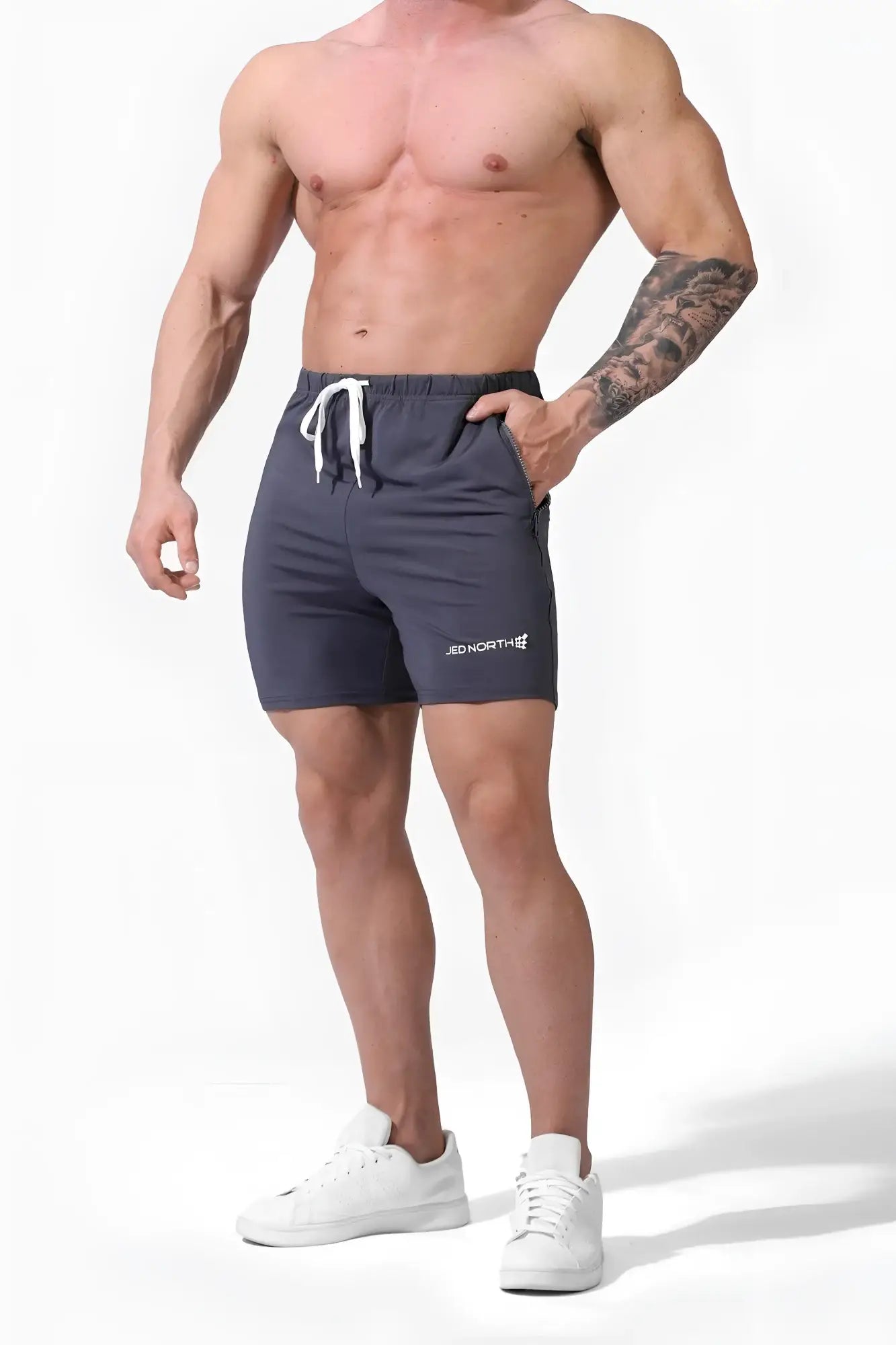 Dark gray Jed North Agile Plus 6.5 inch bodybuilding shorts with white drawstrings and zipper pockets for gym use