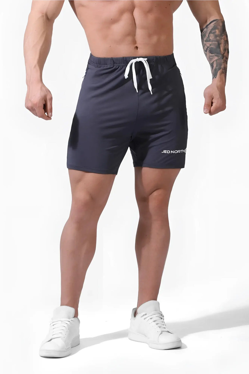 Dark gray jed north agile plus 6.5 inch bodybuilding shorts with white drawstring and zipper pockets