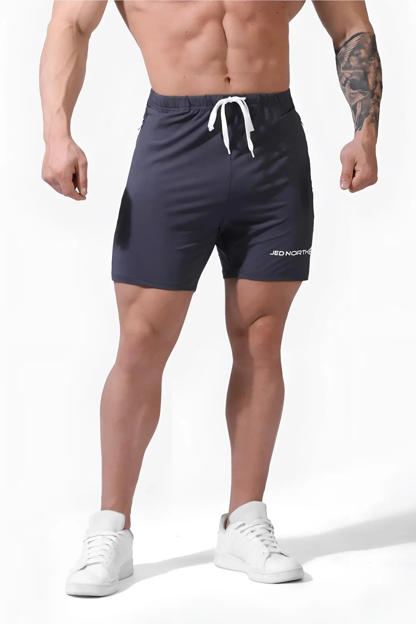 Dark gray jed north agile plus 6.5 inch bodybuilding shorts with white drawstring and zipper pockets