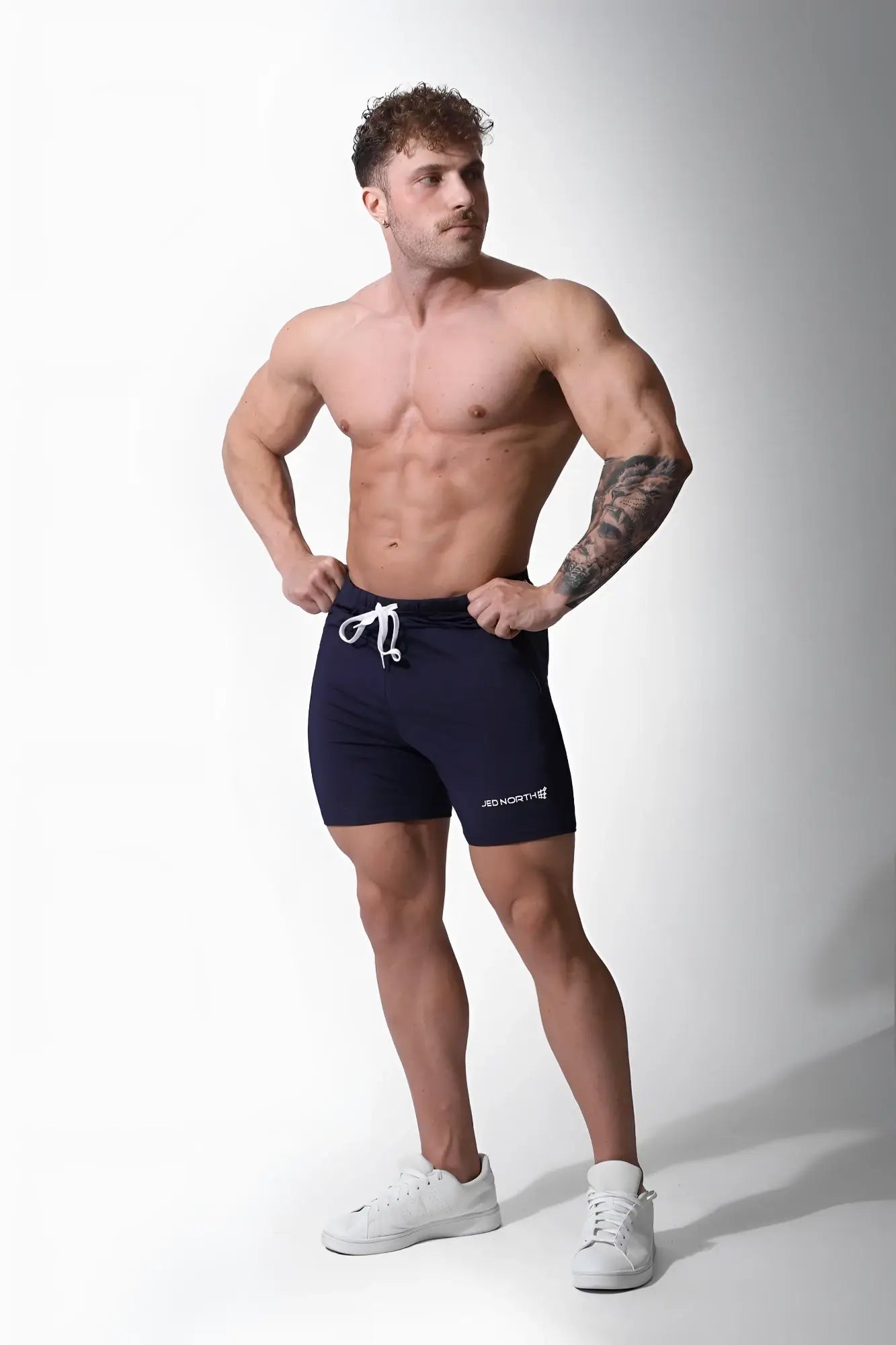 Navy blue Jed North Agile Plus 6.5 inch bodybuilding shorts with white drawstring and zipper pockets for gym use