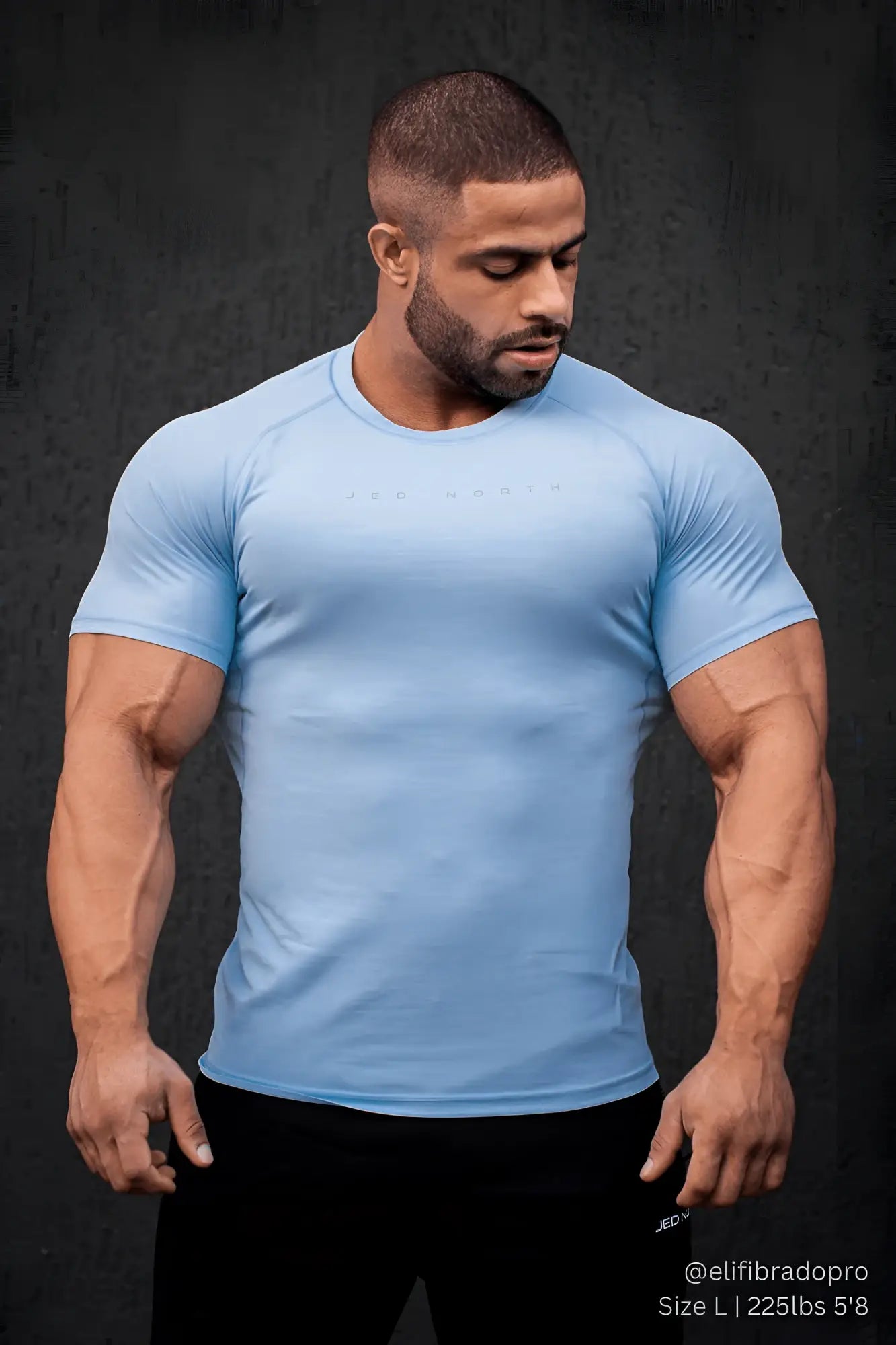 Light blue short sleeve athletic shirt by Jed North with subtle chest logo designed for training and agility