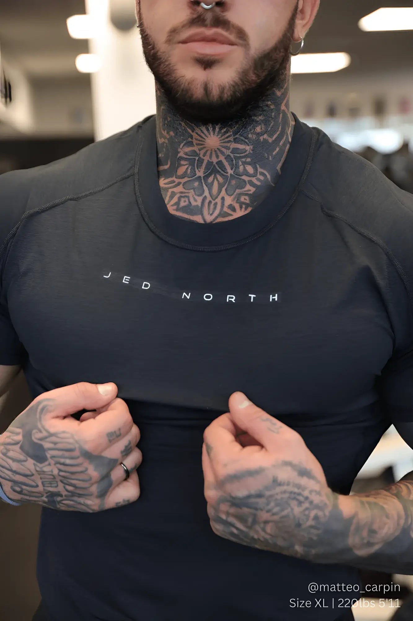 Dark gray fitted athletic t-shirt with jed north printed across the chest in white for training and workouts